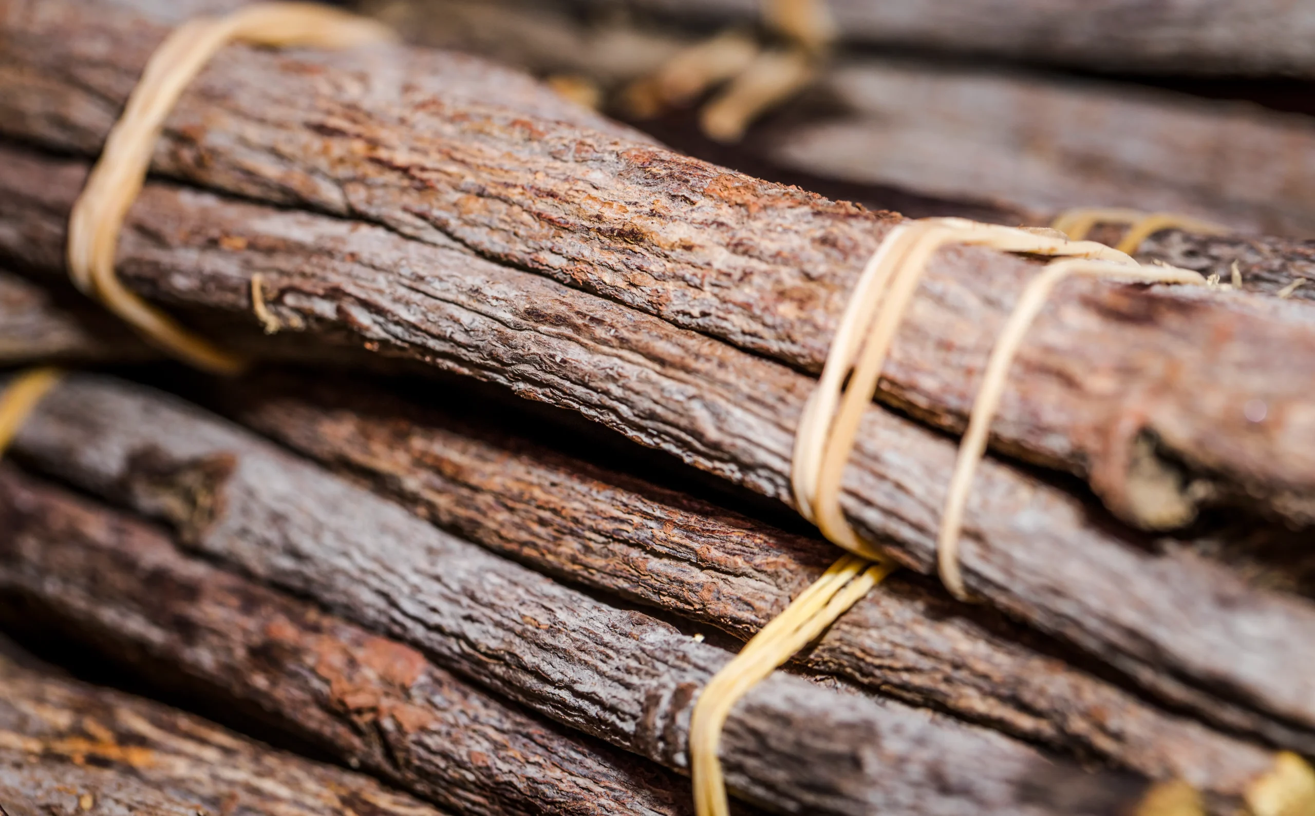 Oud Wood: The Complete Guide To Real Agarwood And What It Smells Like 5 close up stacked cinnamon sticks scaled
